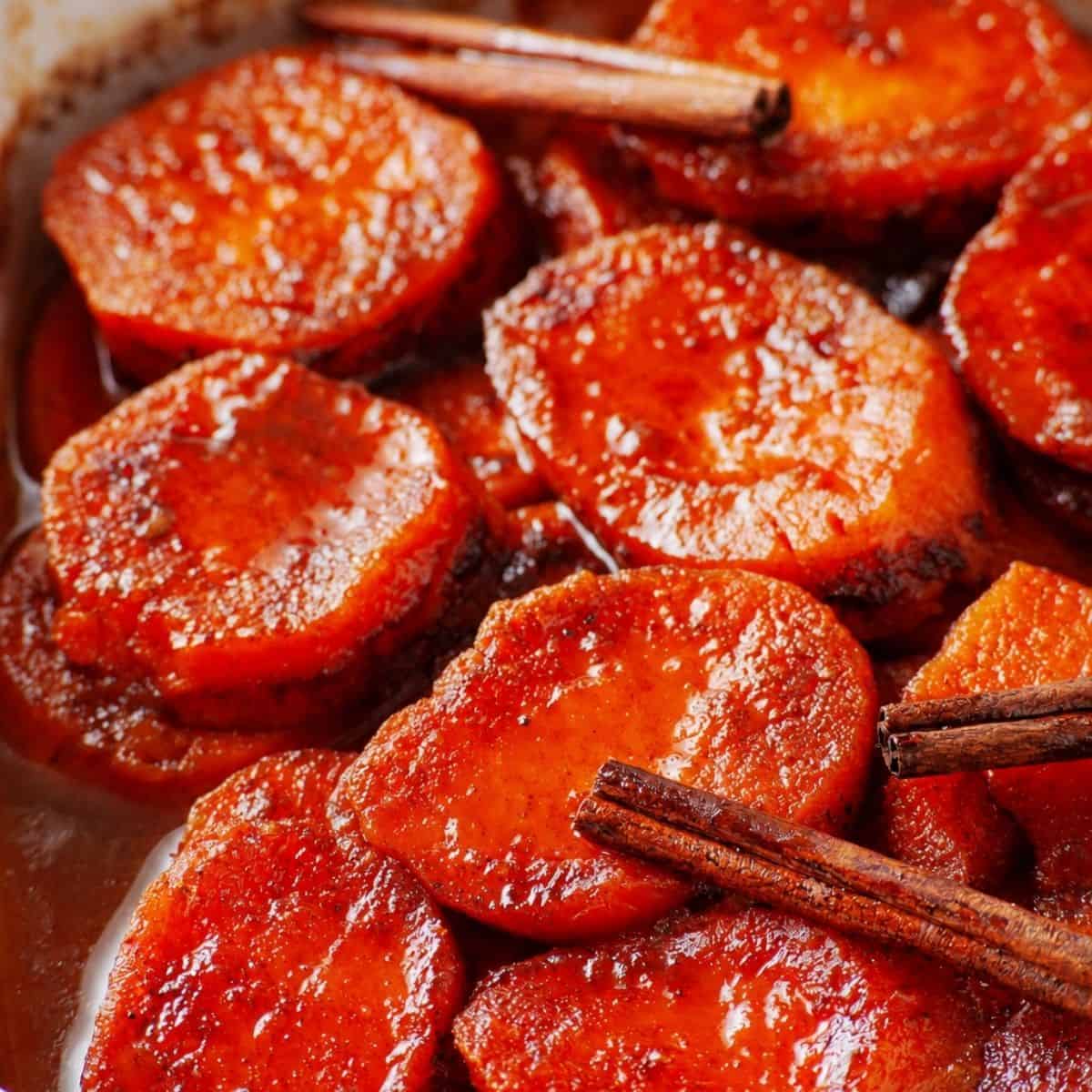 Homemade candied yams with a rich buttery cinnamon-orange syrup