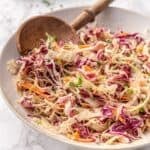 Vinegar based coleslaw with crisp vegetables and a sweet tangy dressing
