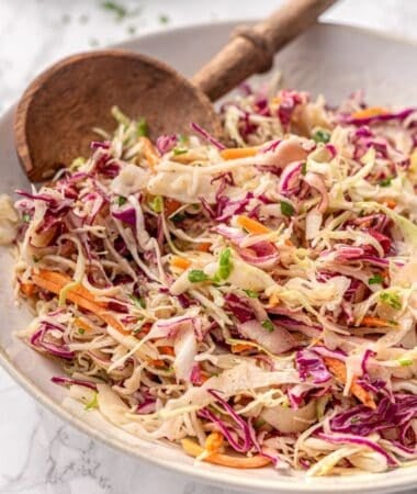 Vinegar based coleslaw with crisp vegetables and a sweet tangy dressing
