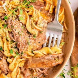 Beef and noodles crockpot recipe with tender chuck roast and egg noodles