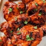 Baked BBQ chicken thighs boneless roasted until tender and lightly charred