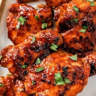 Baked BBQ chicken thighs boneless roasted until tender and lightly charred