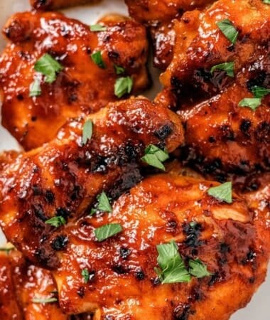 Baked BBQ chicken thighs boneless roasted until tender and lightly charred