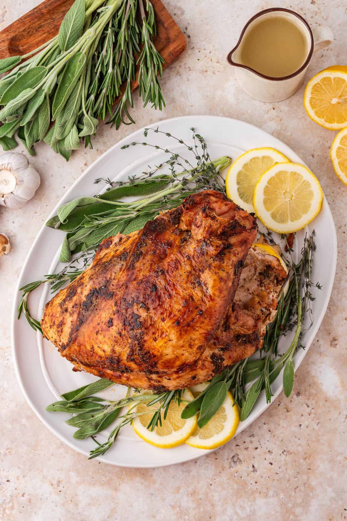 Bone in roast turkey breast with seasoned butter spread over and under the skin