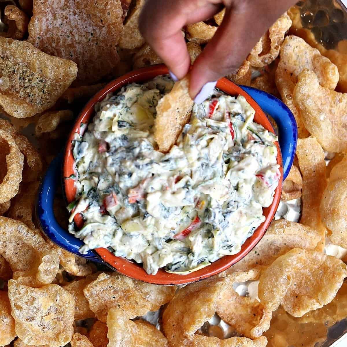 kale and artichoke dip warmed in a small bowl