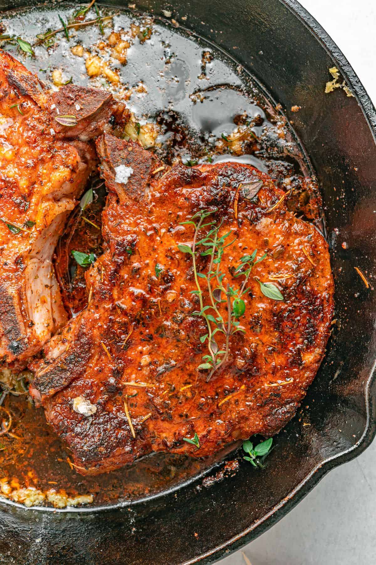 Bone-in pork chops oven finished with melted garlic herb butter