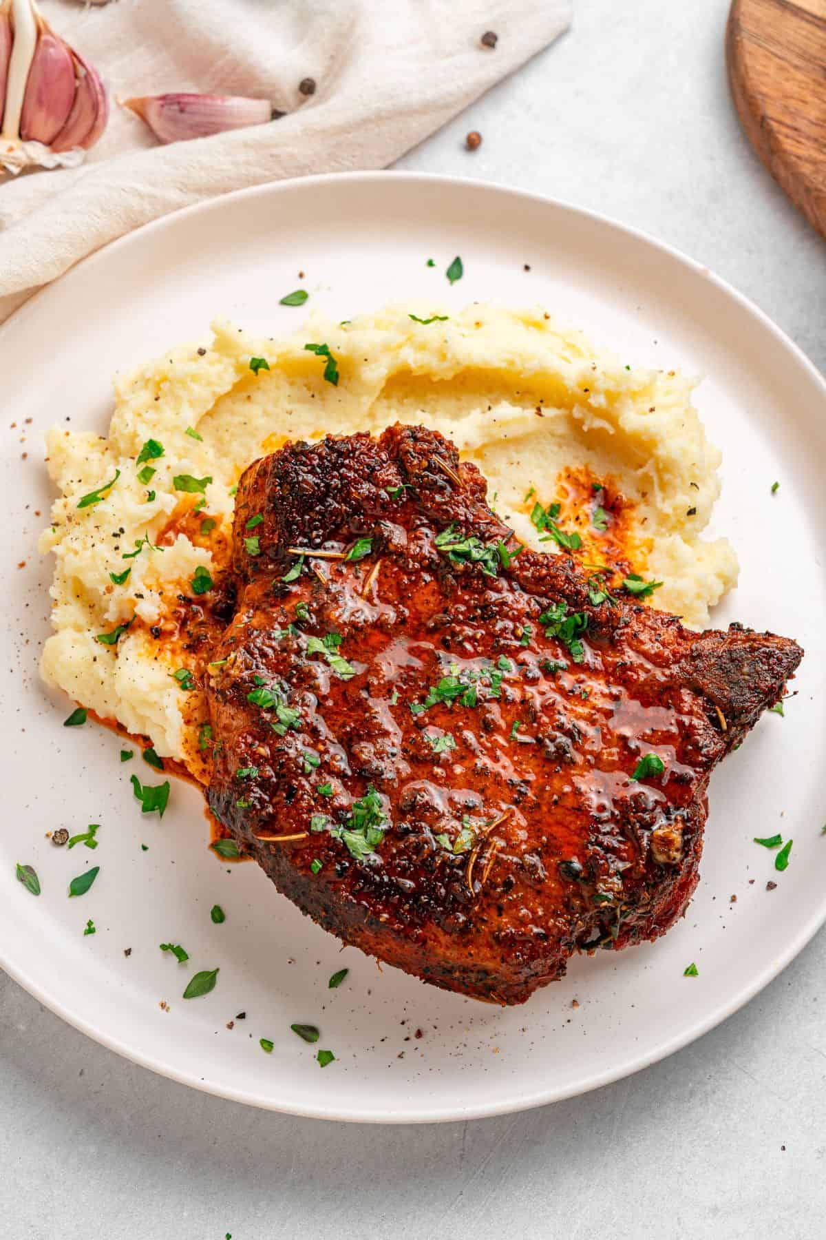 Baked bone in pork chops with a crispy crust and juicy center