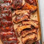 Oven baked pork ribs with a flavorful dry rub and glossy BBQ glaze