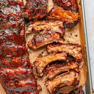 Oven baked pork ribs with a flavorful dry rub and glossy BBQ glaze