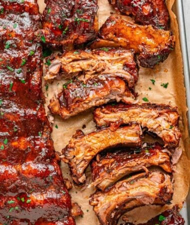 Oven baked pork ribs with a flavorful dry rub and glossy BBQ glaze