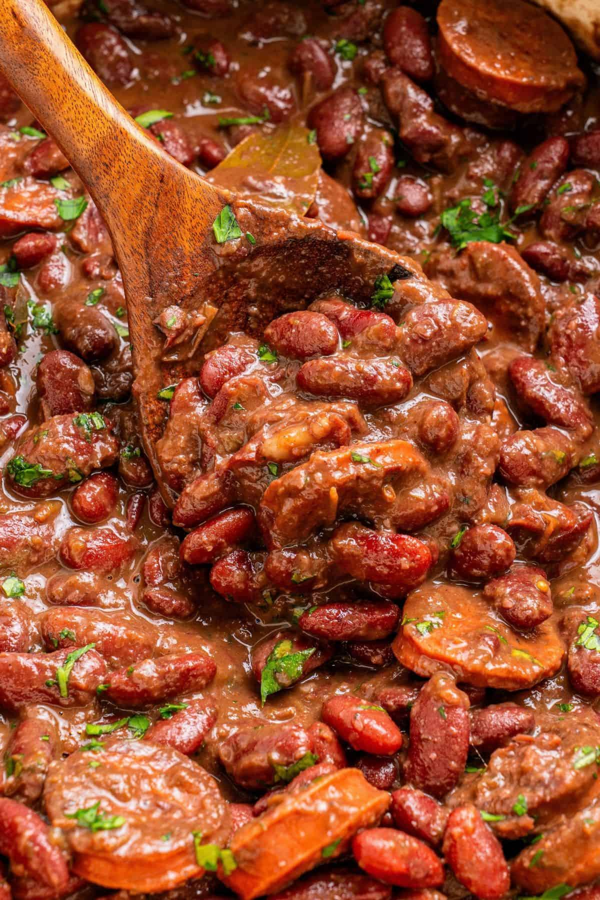 Red beans and rice with sausage served over white rice with a rich bean gravy