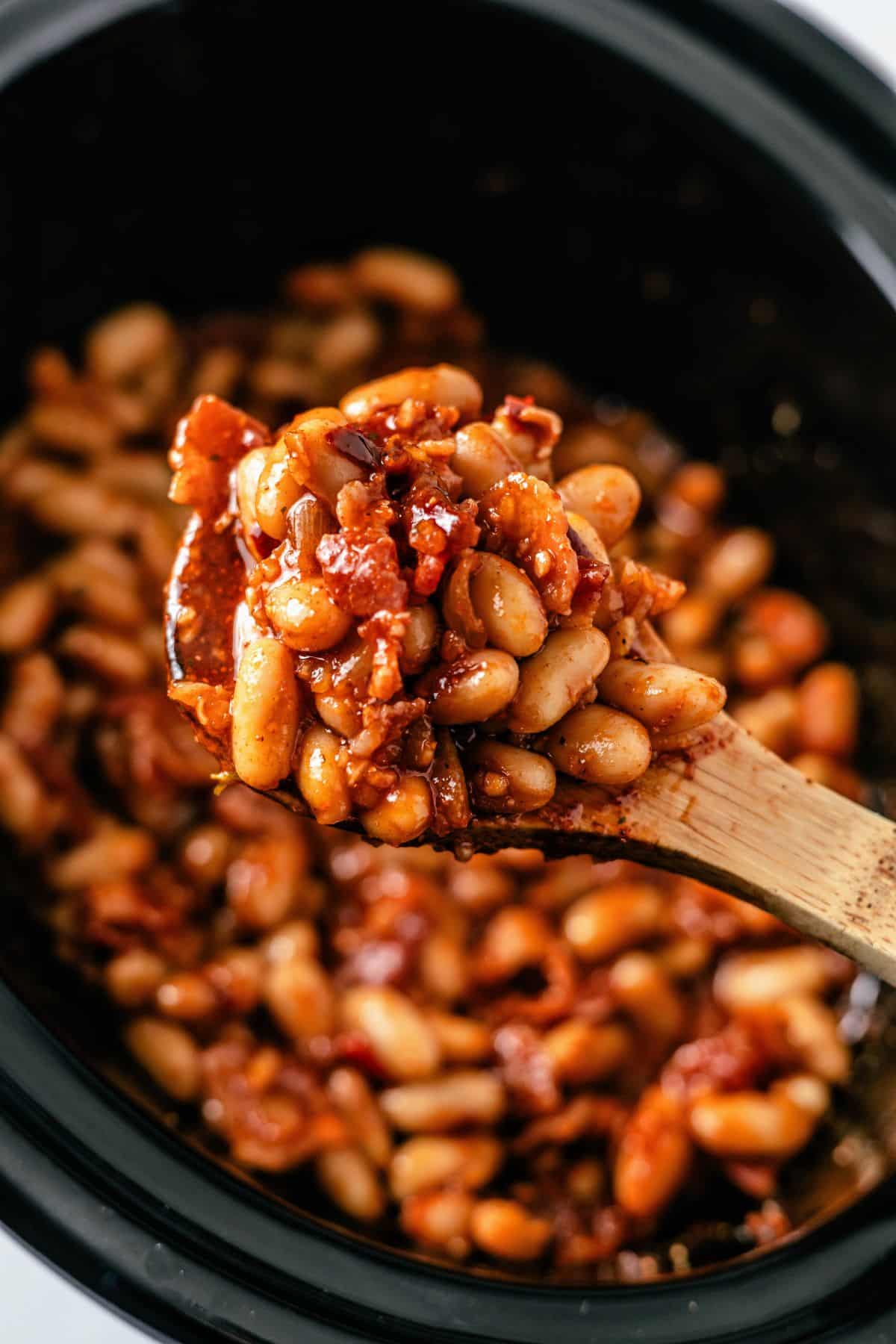 Baked beans with bacon simmered in a smoky, sweet BBQ sauce