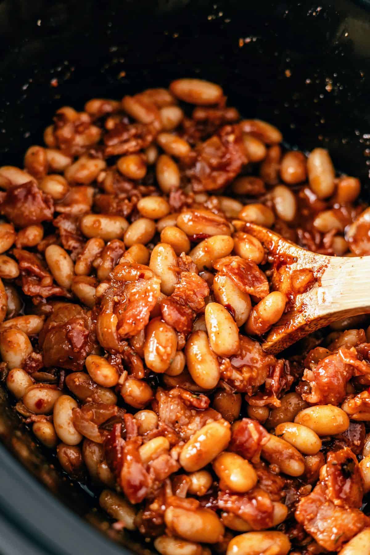 Slow cooker baked beans with bacon cooked low and slow until tender
