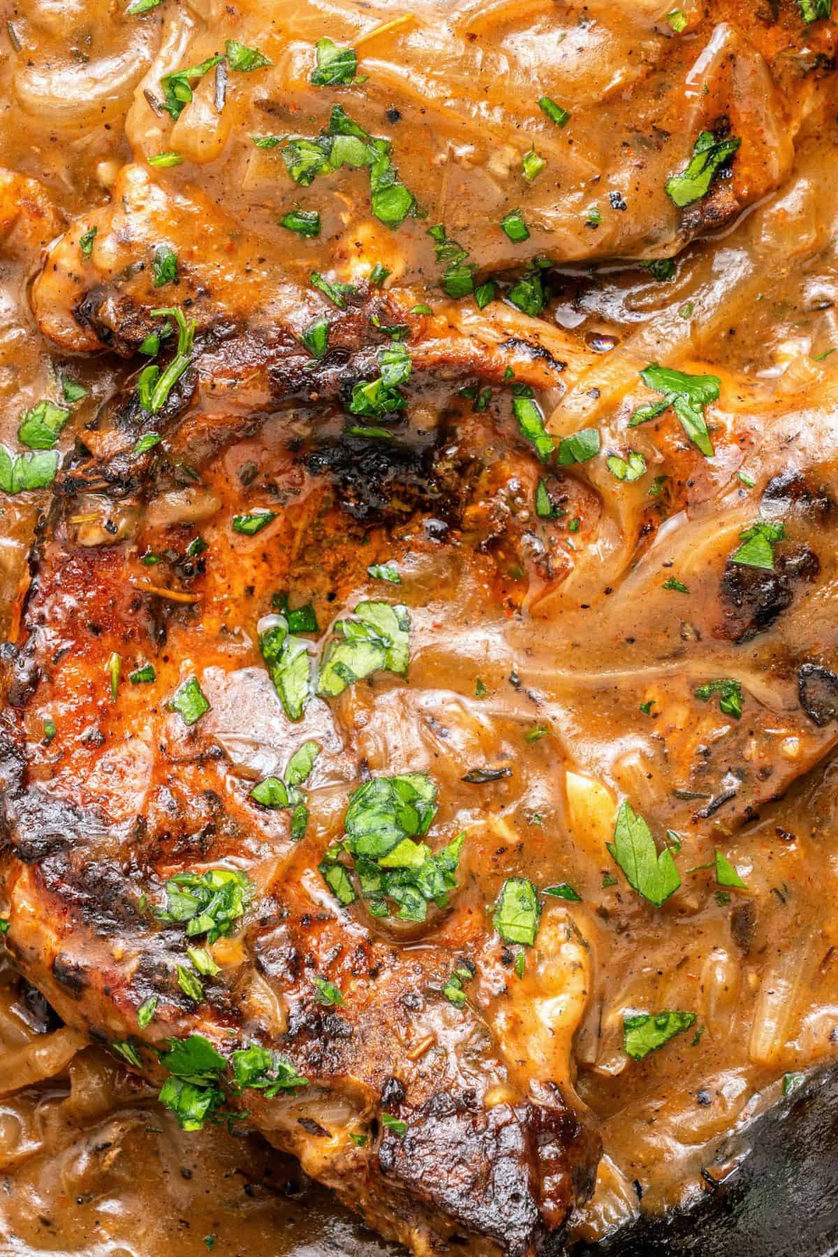 Pork chops with onion gravy and soft caramelized onions