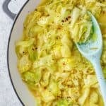 Braised cabbage recipe made with fresh cabbage, chopped onions, butter, and savory chicken broth