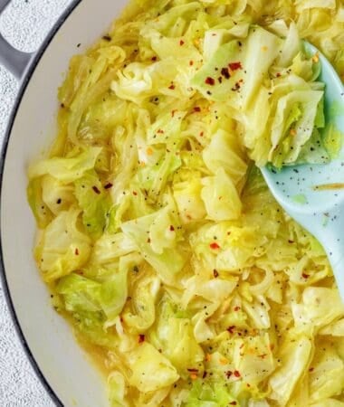 Braised cabbage recipe made with fresh cabbage, chopped onions, butter, and savory chicken broth