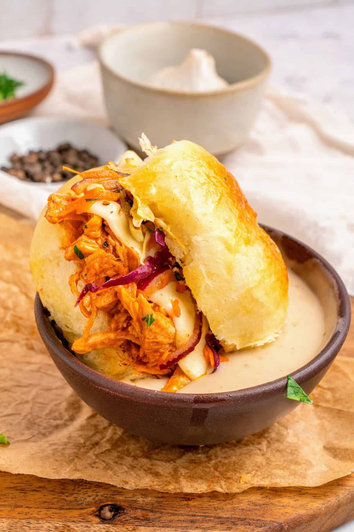 Buffalo chicken sliders recipe with tender shredded chicken and gooey melted cheese