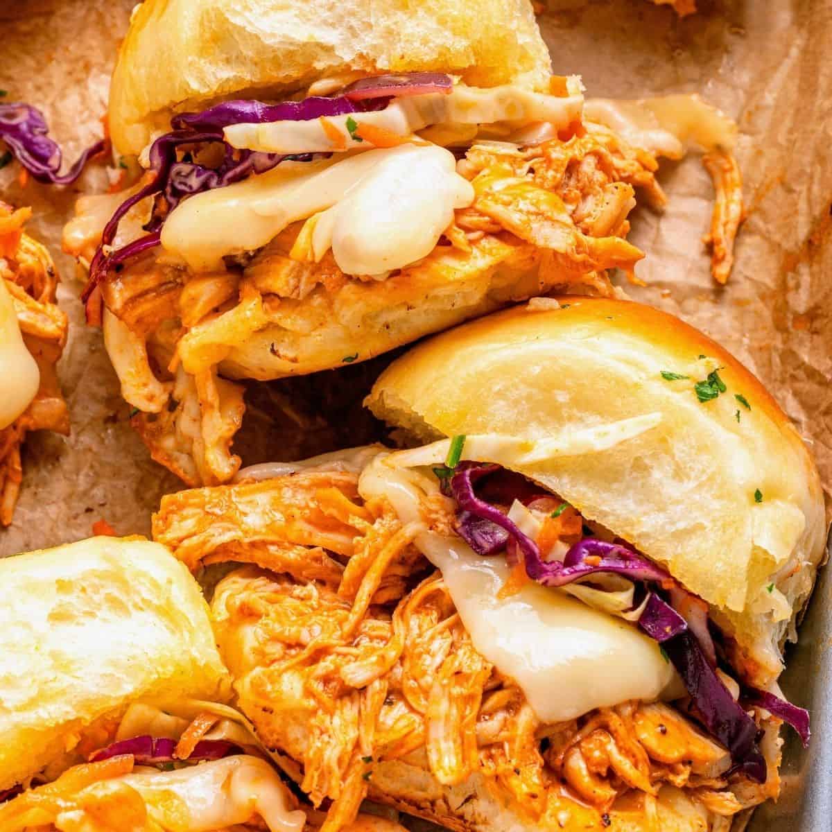 Hawaiian roll buffalo chicken sliders with a golden seasoned butter topping