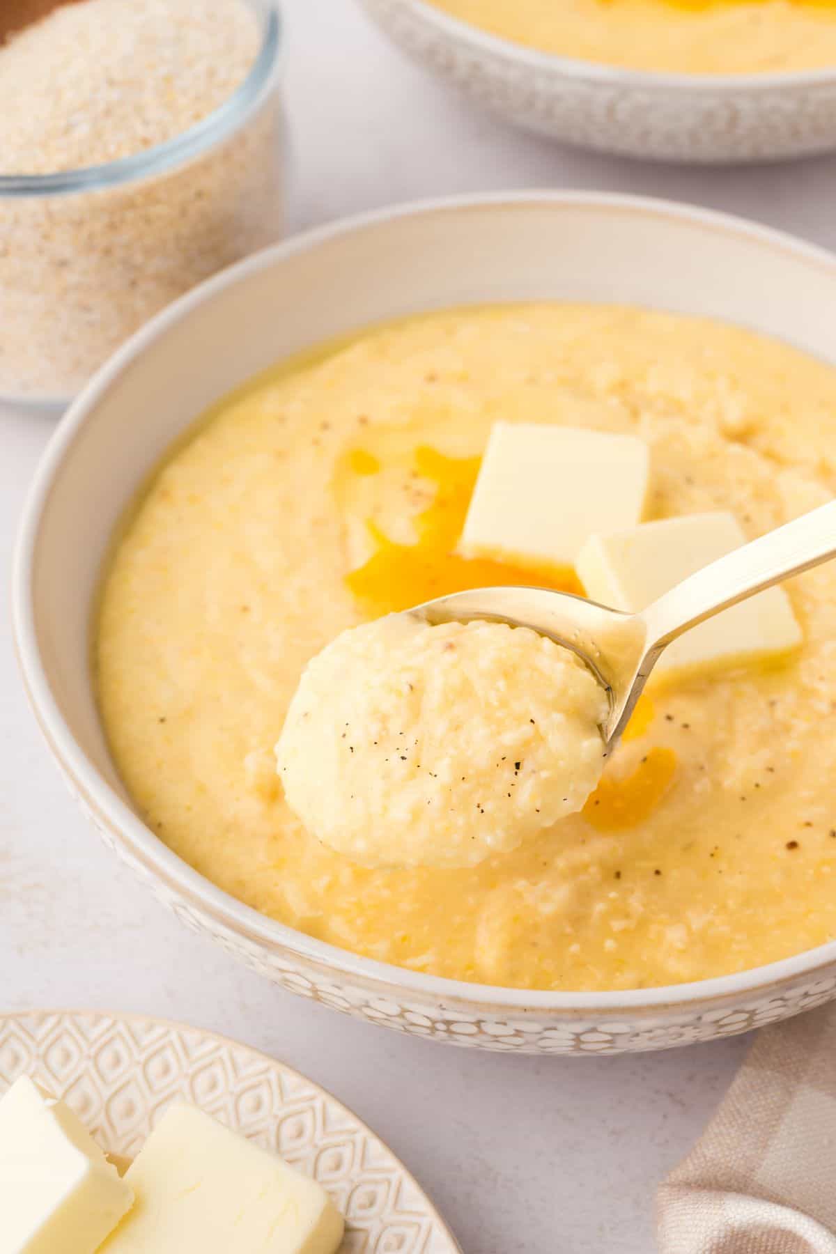 Cheesy grits with butter and sharp cheddar cheese melted into a creamy Southern-style side dish