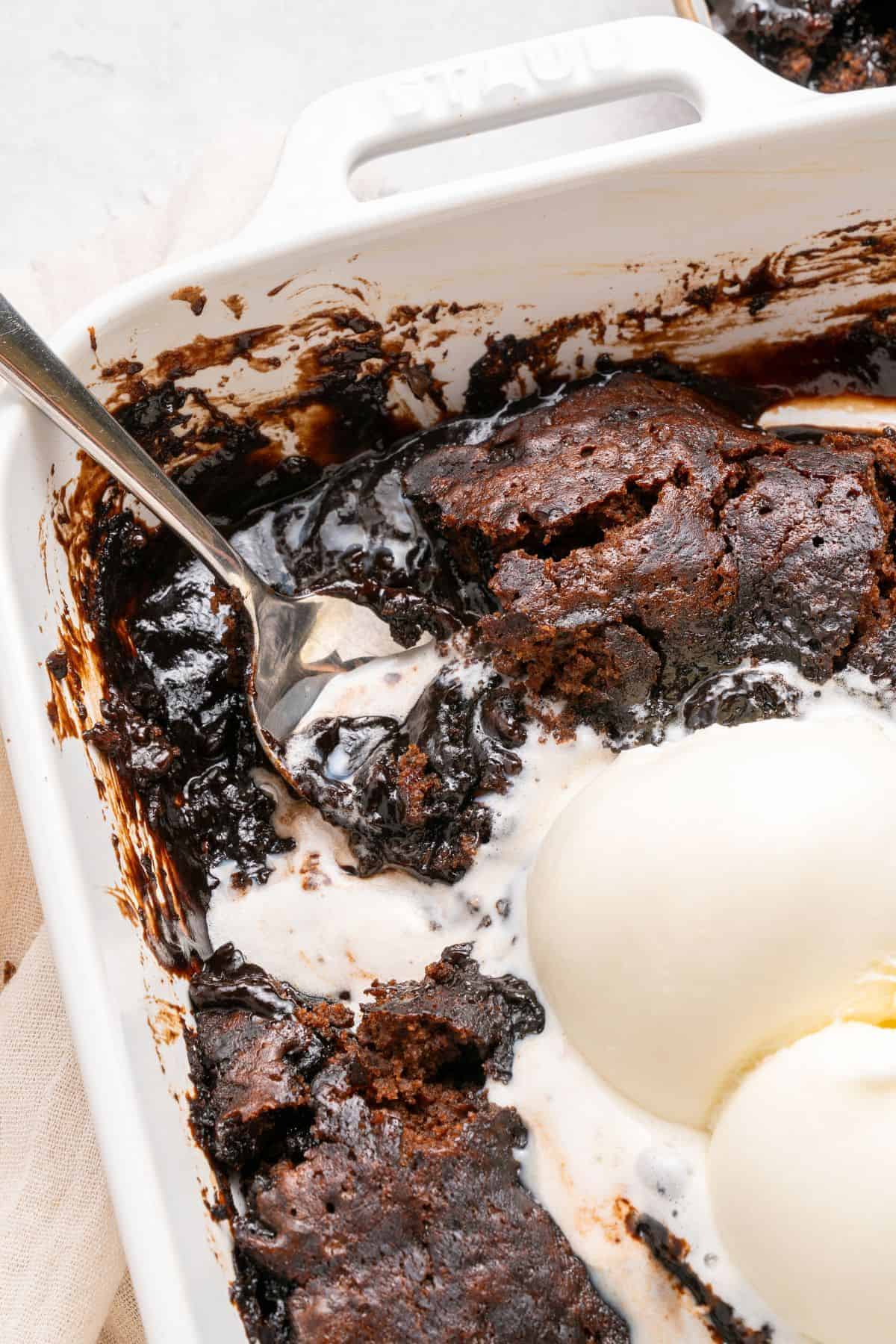 Pudding cake with a soft brownie-like texture and warm chocolate fudge sauce