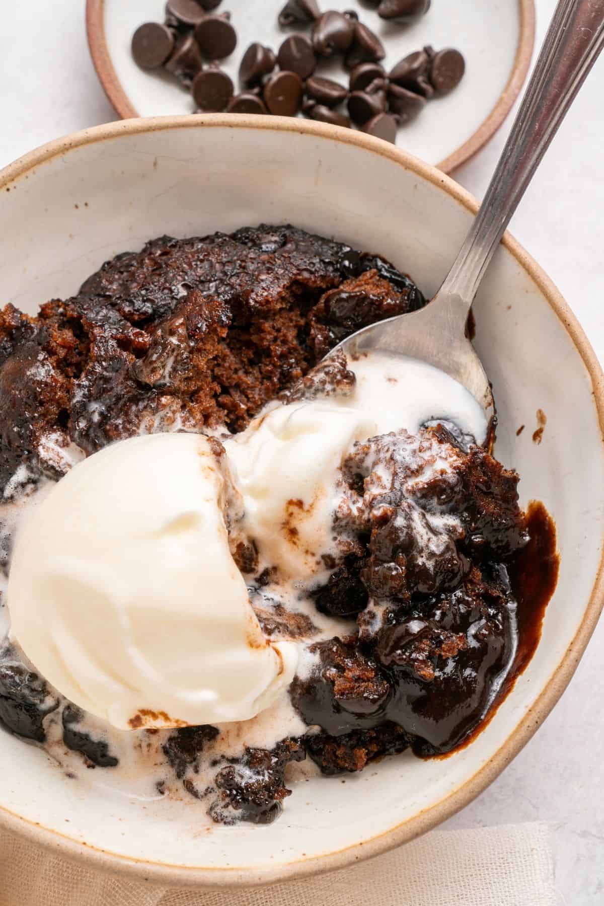 Hot fudge pudding cake recipe baked into two layers of cake and chocolate sauce