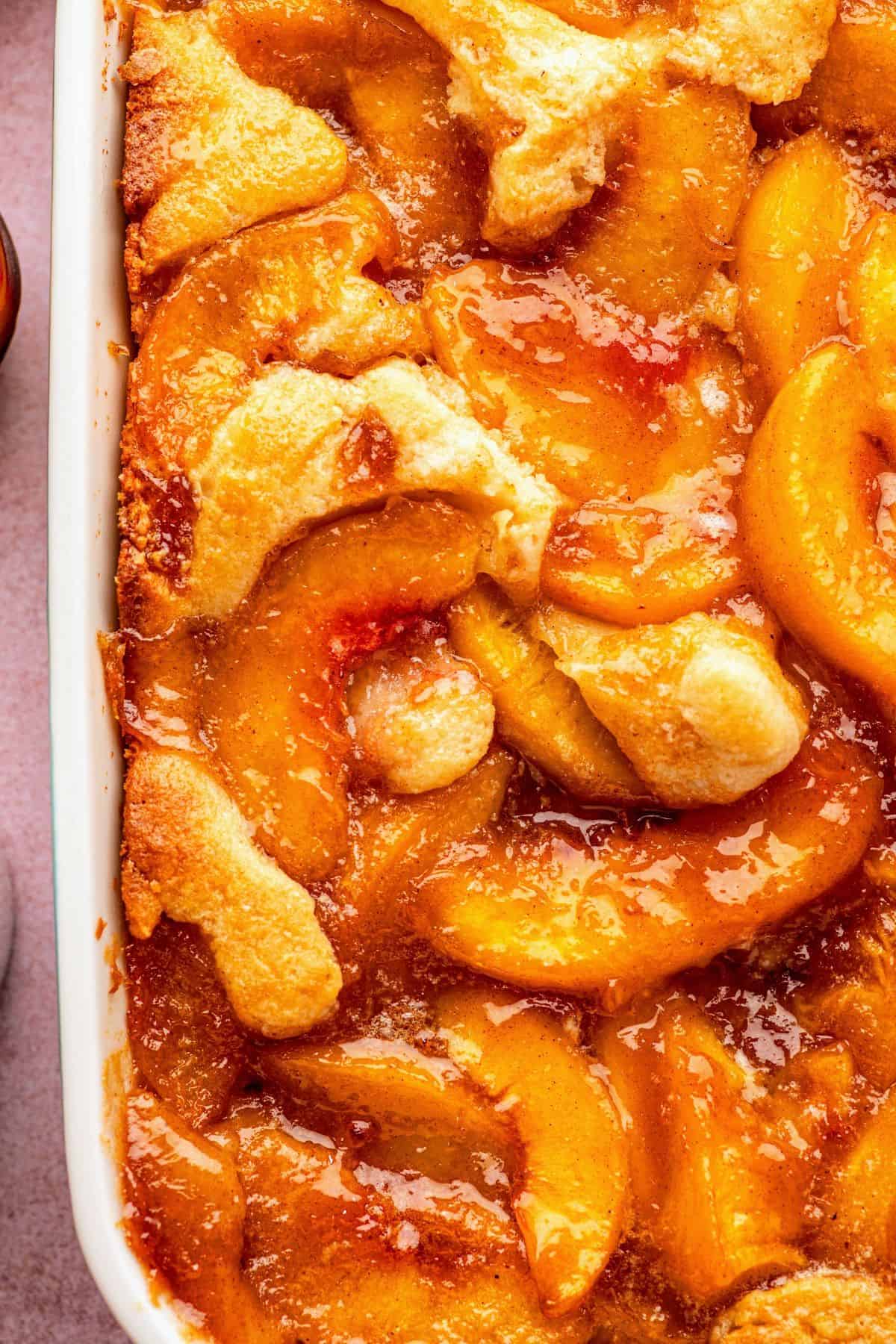 Easy simple peach cobbler recipe served warm with a tender cake-like topping.