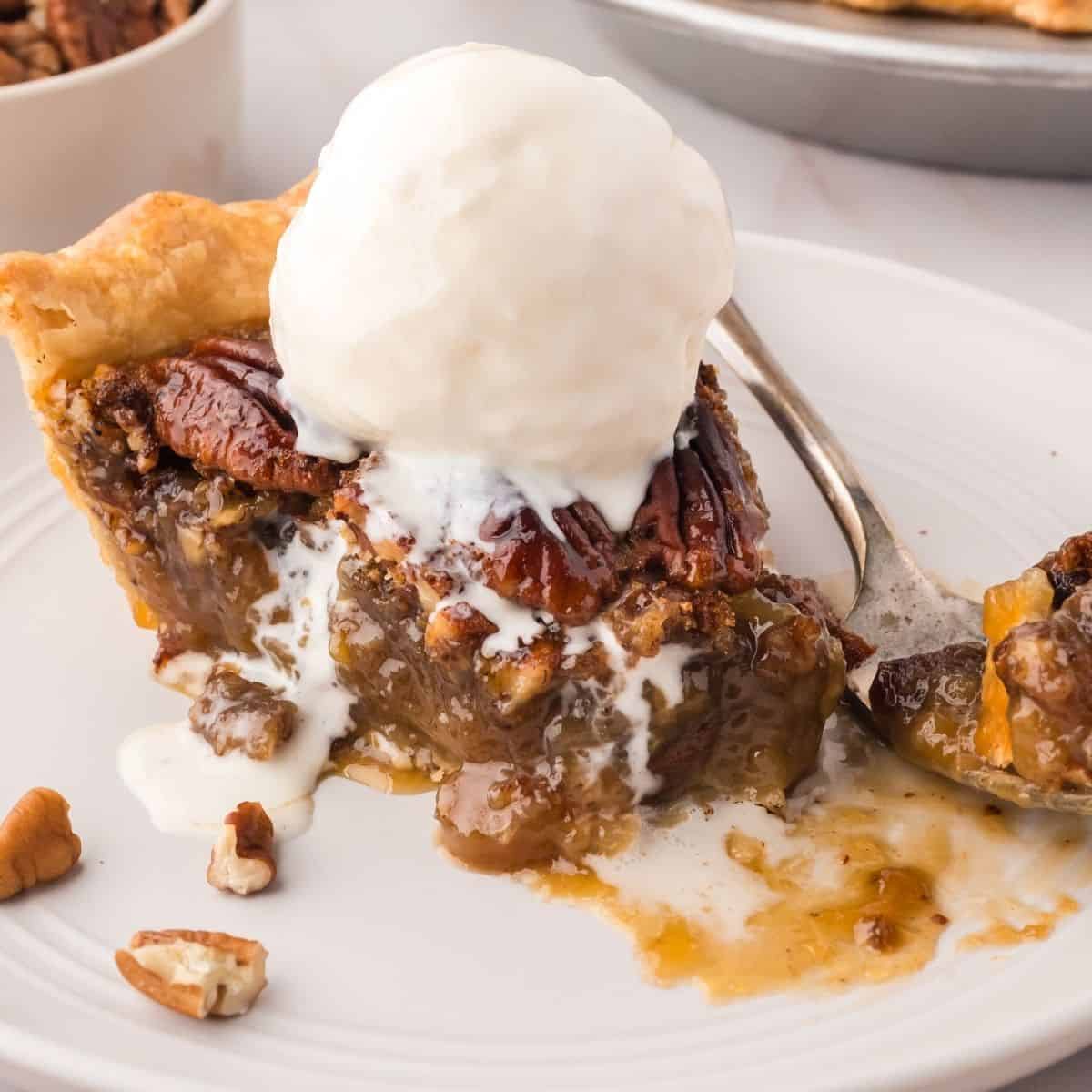 Pecan pie baked with a golden crust, caramel-like filling, and crunchy toasted pecans