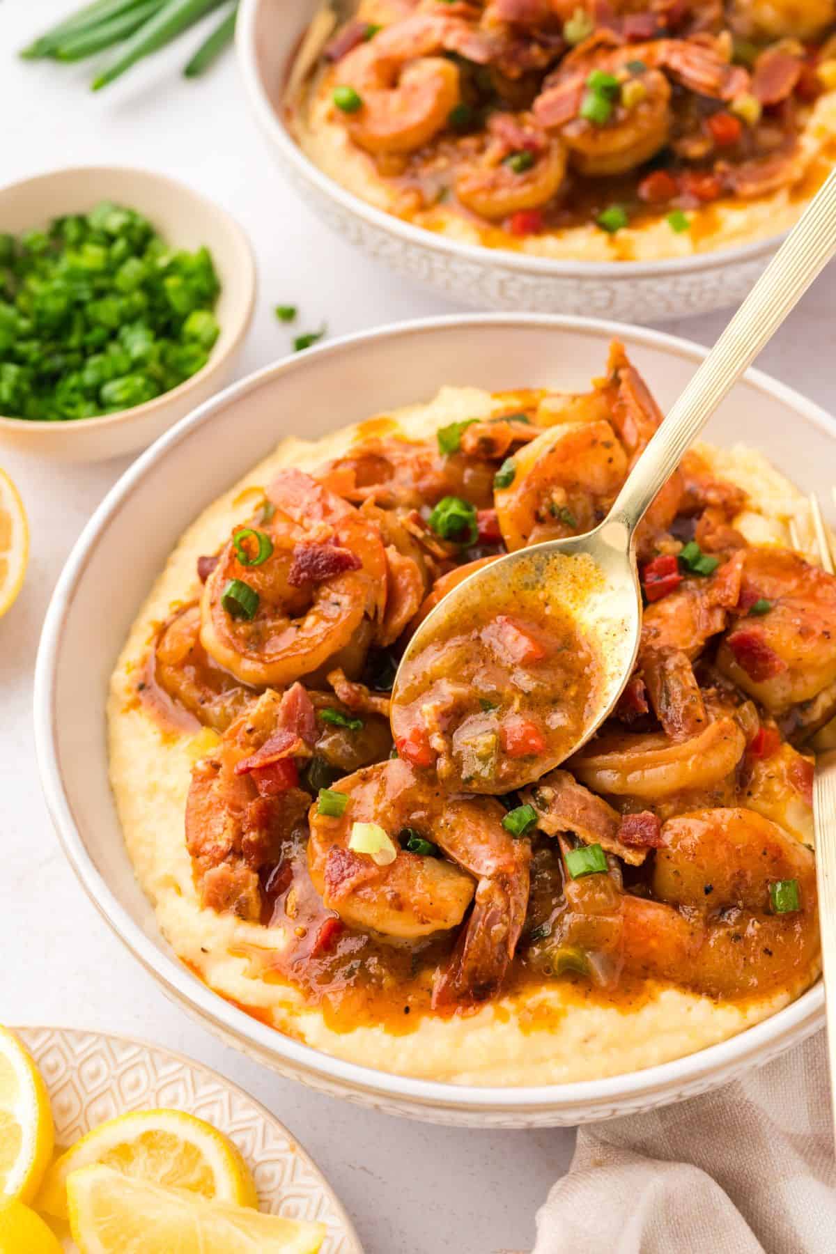 Easy shrimp and grits recipe made with sautéed vegetables, smoky bacon, and tender shrimp