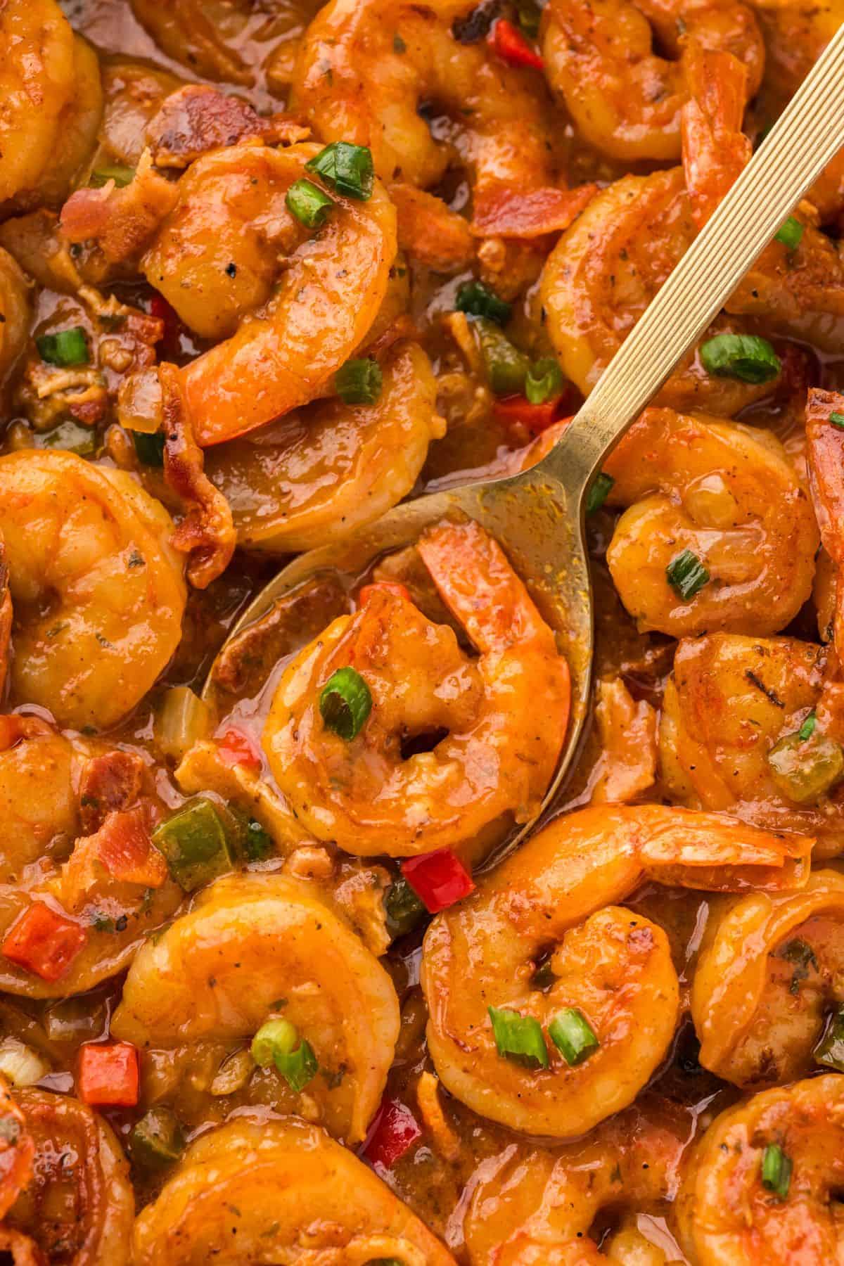 Creamy shrimp and grits with Cajun-seasoned shrimp and colorful vegetables served in a shallow bowl