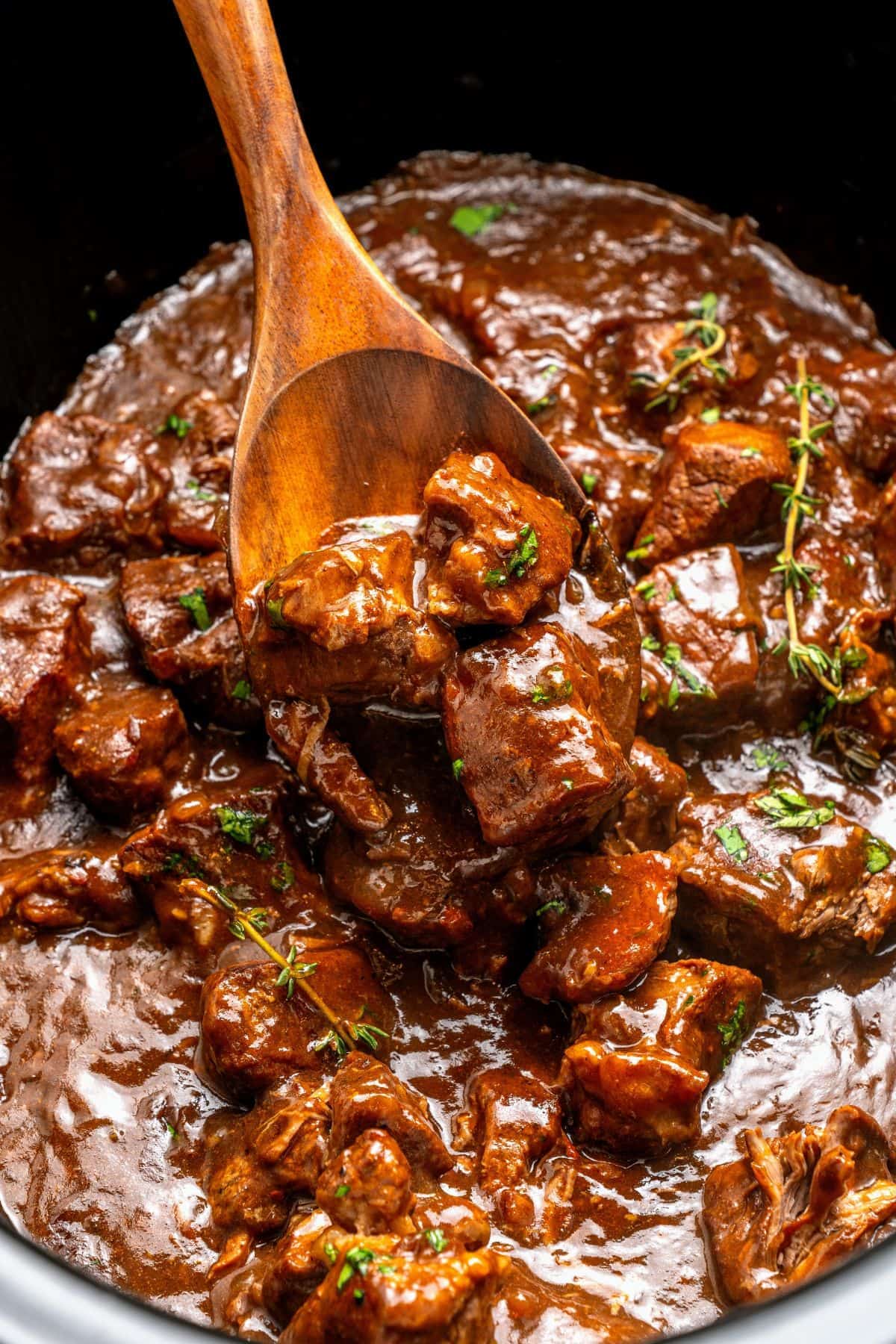 crock pot beef tips and gravy spooned over fluffy white rice for a comforting meal