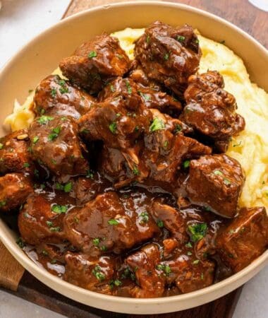 Slow cooked beef tips and gravy served with mashed potatoes and savory brown sauce