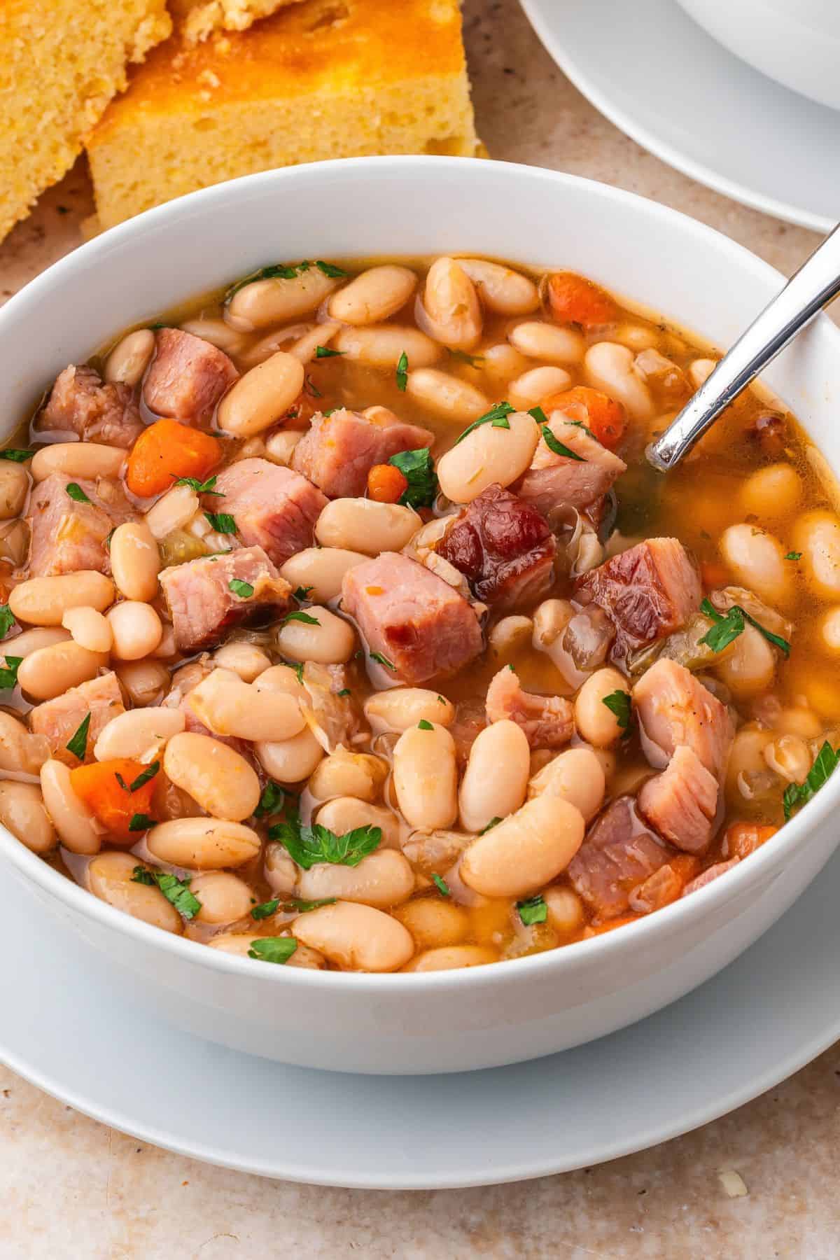 Ham and bean soup with ham bone cooked low and slow until the beans are creamy