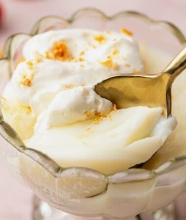 Vanilla pudding from scratch spooned into a serving dish for a simple dessert.